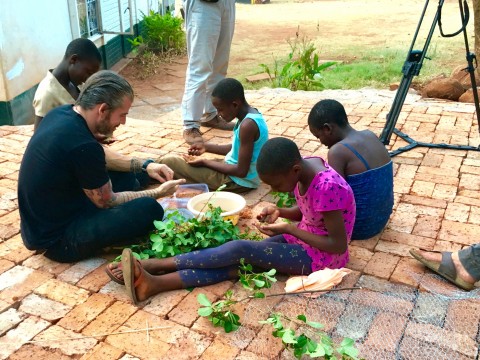 Lars Williams, Noma head of R&D, foraging Masokosiyana berries with some of Chido Govera's girls